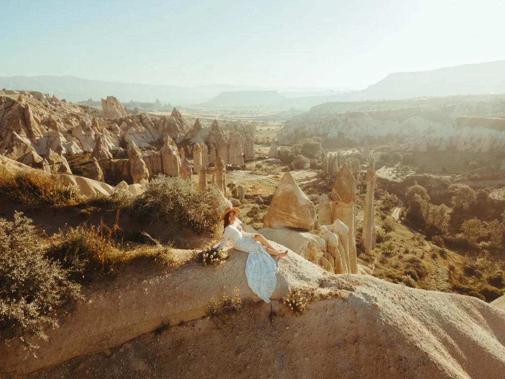 bride sitting on hill in cappadocia, prewedding